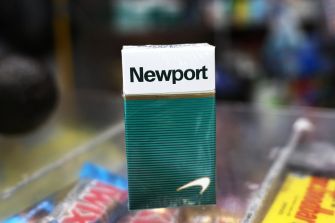 A pack of Newport menthol cigarettes displayed on a store counter.