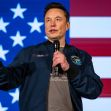 Elon Musk speaking at an event with a U.S. flag backdrop. Elon Musk speaking at an event with a U.S. flag backdrop.