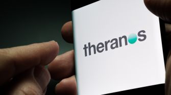 Logo of Theranos displayed on a mobile device.