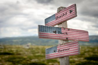 Signpost with "Build Back Better" written on it, featuring the American flag design.