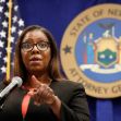 New York Attorney General Letitia James speaking at a press conference with the state seal in the background. New York Attorney General Letitia James speaking at a press conference with the state seal in the background.