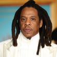 Jay-Z attending an event, dressed in a white suit. Jay-Z attending an event, dressed in a white suit.