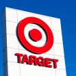 Target store sign against a clear blue sky. Target store sign against a clear blue sky.