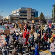 Protesters gather outside a courthouse holding signs related to immigration enforcement and judicial accountability. Protesters gather outside a courthouse holding signs related to immigration enforcement and judicial accountability.