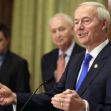 Arkansas Gov. Asa Hutchinson, right, speaks during a news conference in Little Rock, Ark.