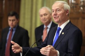 Arkansas Governor Asa Hutchinson speaks during a press conference following the signing of a bill allowing doctors to refuse treatment based on conscience.