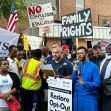 Protesters at a rally opposing educational policies on transgender issues, holding signs related to parental rights and educational choices. Protesters at a rally opposing educational policies on transgender issues, holding signs related to parental rights and educational choices.
