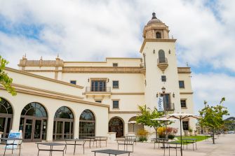 University of San Diego campus building with outdoor seating area.