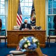 President Biden signs an executive order in the Oval Office, accompanied by Vice President Kamala Harris and Secretary of Defense Lloyd Austin. President Biden signs an executive order in the Oval Office, accompanied by Vice President Kamala Harris and Secretary of Defense Lloyd Austin.