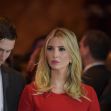 Ivanka Trump attending an event, looking serious, with a man beside her. Ivanka Trump attending an event, looking serious, with a man beside her.