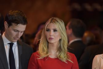 Ivanka Trump attending an event, looking serious, with a man beside her.