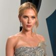 Scarlett Johansson at an event, wearing an elegant gown and posing for the camera. Scarlett Johansson at an event, wearing an elegant gown and posing for the camera.