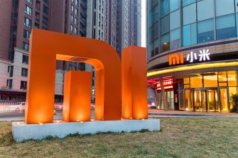 Xiaomi's corporate logo displayed in front of one of its stores.