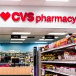 CVS Pharmacy store interior with shelves of over-the-counter medicines and the CVS sign prominently displayed. CVS Pharmacy store interior with shelves of over-the-counter medicines and the CVS sign prominently displayed.