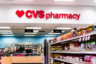 CVS Pharmacy store interior with shelves of over-the-counter medicines and the CVS sign prominently displayed.