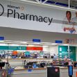 Interior view of a Walmart pharmacy, showing the pharmacy counter and signage. Interior view of a Walmart pharmacy, showing the pharmacy counter and signage.