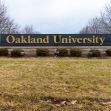 Signage for Oakland University, featuring the university name prominently displayed. Signage for Oakland University, featuring the university name prominently displayed.