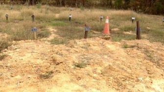 Graves marked by metal tags in a pauper's field behind a jail in Jackson, Mississippi, where 215 individuals have been buried since 2016.