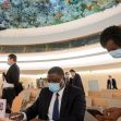 A meeting setting in a United Nations conference room, with delegates wearing masks, engaged in discussion. A meeting setting in a United Nations conference room, with delegates wearing masks, engaged in discussion.