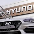 Hyundai logo sign i30 on front grill of grey new car vehicle