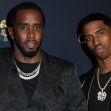 Father and son, Sean "Diddy" Combs and Christian "King" Combs, pose together at an event. Father and son, Sean "Diddy" Combs and Christian "King" Combs, pose together at an event.
