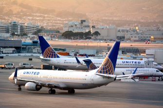 United Airlines airplanes on the tarmac at an airport.