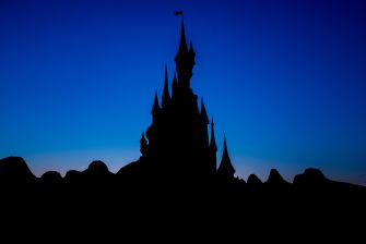 Silhouette of a castle against a twilight sky.