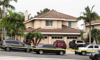 Police tape surrounds the home of Judge Jeffrey Ferguson in Anaheim, California, following the shooting death of his wife.