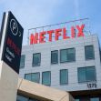 Netflix office building exterior with a sign indicating guest valet parking. Netflix office building exterior with a sign indicating guest valet parking.