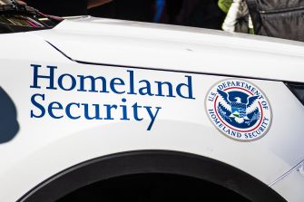 U.S. Department of Homeland Security logo on a vehicle.