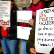 Students holding signs during a protest advocating for a new Title IX to ensure learning environments free from discrimination and harassment. Students holding signs during a protest advocating for a new Title IX to ensure learning environments free from discrimination and harassment.