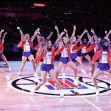 A group of Los Angeles Clippers dancers performing at a basketball game on the court. A group of Los Angeles Clippers dancers performing at a basketball game on the court.