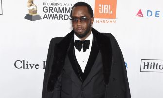 Sean Combs, also known as Diddy, attending a Grammy Awards event in formal attire.