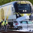 A damaged car after a collision with a Brightline train, with emergency responders on the scene. A damaged car after a collision with a Brightline train, with emergency responders on the scene.