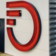 Signage of Frontier Communications displaying the company logo and address. Signage of Frontier Communications displaying the company logo and address.