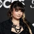 A close-up of British singer-songwriter Lola Young at a public event, showcasing her unique fashion and style. A close-up of British singer-songwriter Lola Young at a public event, showcasing her unique fashion and style.