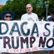 Protesters holding a banner that reads "DACA SÍ, TRUMP NO" during a demonstration advocating for the DACA program. Protesters holding a banner that reads "DACA SÍ, TRUMP NO" during a demonstration advocating for the DACA program.