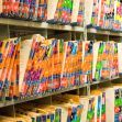 Color-coded and labeled medical files organized in a storage area. Color-coded and labeled medical files organized in a storage area.