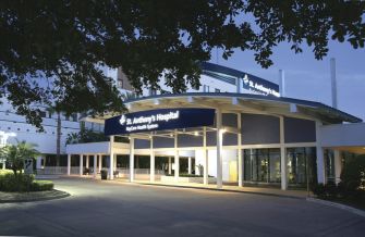 Entrance of St. Anthony's Hospital in Florida at dusk.