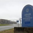 Signage for Adair Youth Development Center in Kentucky, amidst a backdrop of the facility's entrance. Signage for Adair Youth Development Center in Kentucky, amidst a backdrop of the facility's entrance.