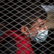 Asylum seeking unaccompanied minors are transported in a U.S. Border Patrol vehicle after they crossed the Rio Grande river into the United States from Mexico on a raft in Penitas, Texas, March 9, 2021.