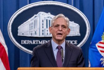 Attorney General Merrick Garland speaking at a press conference regarding the Department of Justice's lawsuit against Texas over alleged violations of the Voting Rights Act.