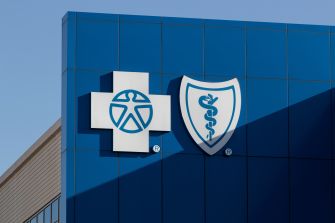 Logo of Blue Cross Blue Shield on the exterior of a building.