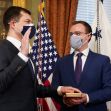 Pete Buttigieg, with his hand on the Bible held by husband Chasten Buttigieg, is sworn in as Transportation Secretary by Vice President Kamala Harris in the Old Executive Office Building in the White House complex in Washington, Wednesday, Feb. 3, 2021. (EVIN LAMARQUE /REUTERS)