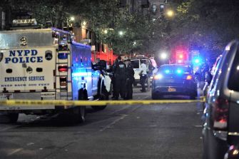 Police vehicles and emergency responders at the scene of a daycare incident in the Bronx, New York.
