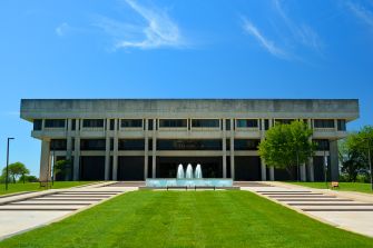 Kansas Supreme Court building with a fountain and green lawn.