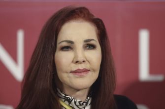 Priscilla Presley attending an event, with a serious expression.