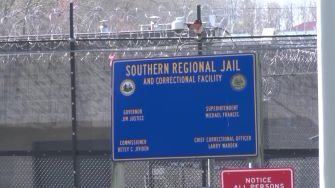 Signage for the Southern Regional Jail and Correctional Facility in West Virginia, showing the names of state officials and the facility's administration.