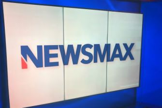 Newsmax logo displayed on a screen.