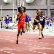 Transgender female athletes competing in a track event, showcasing a diverse group of runners in action. Transgender female athletes competing in a track event, showcasing a diverse group of runners in action.